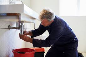 Professional plumber at work